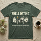 Hermit Crab Shell Dating T-Shirt in Military Green — Vintage-ink hermit crab leaning toward a pristine shell, chipped shell on the right, carved type "Shell Dating. Swipe Left."
