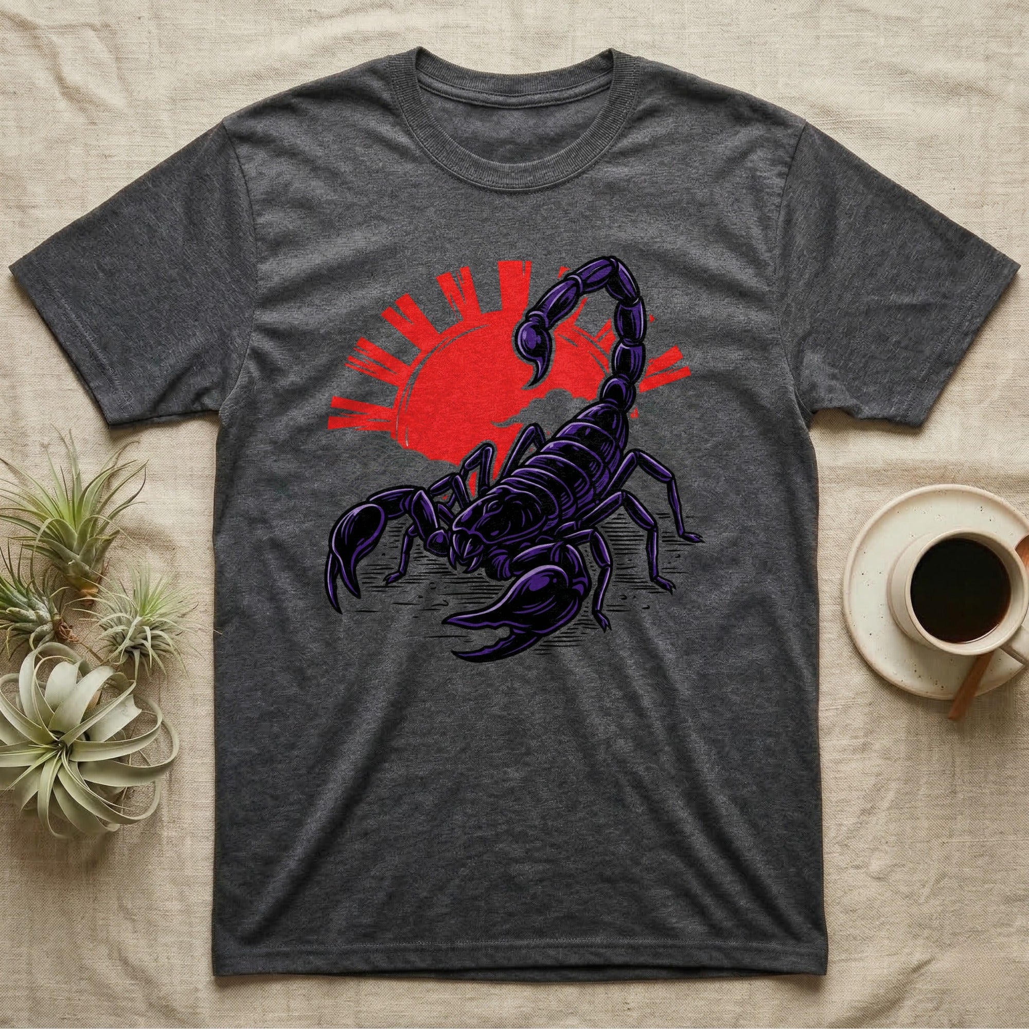 Dark grey t-shirt with a stylized purple scorpion and red sun graphic.