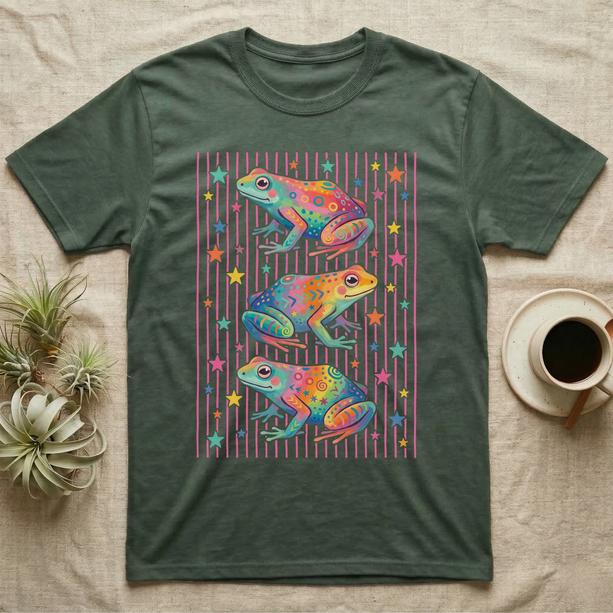 Dart Frog Disco Stripes T-Shirt in Military Green — Three rainbow poison dart frog morphs stacked on a pink-and-cream candy-stripe field with scattered stars.