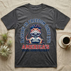 Bearded Dragon Basking T-Shirt in Dark Heather — Sports-logo bearded dragon in a tricorn hat under a collegiate arch reading Basking in Freedom Since 1776.