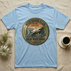 Pale blue t-shirt with a circular "Wild Shark Club Great White Shark" emblem.