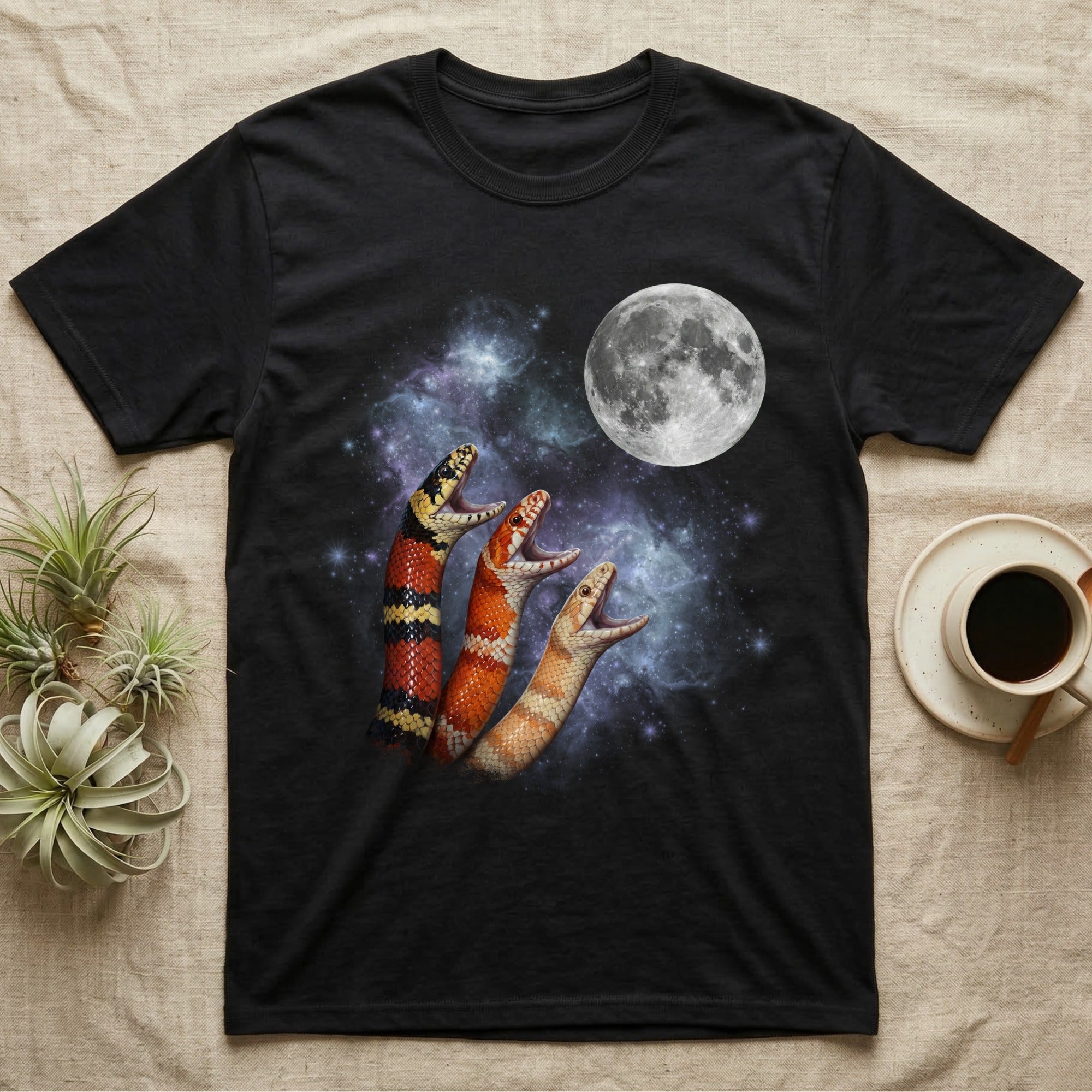 Milk Snake Moon Howl T-Shirt in Black — Three Milk Snake colour morphs howling at a full moon over a nebula on a dark grey t-shirt.