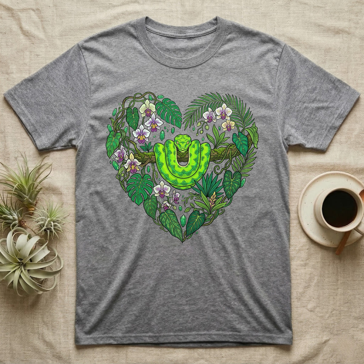Gray t-shirt with green snake and tropical leaves forming a heart.