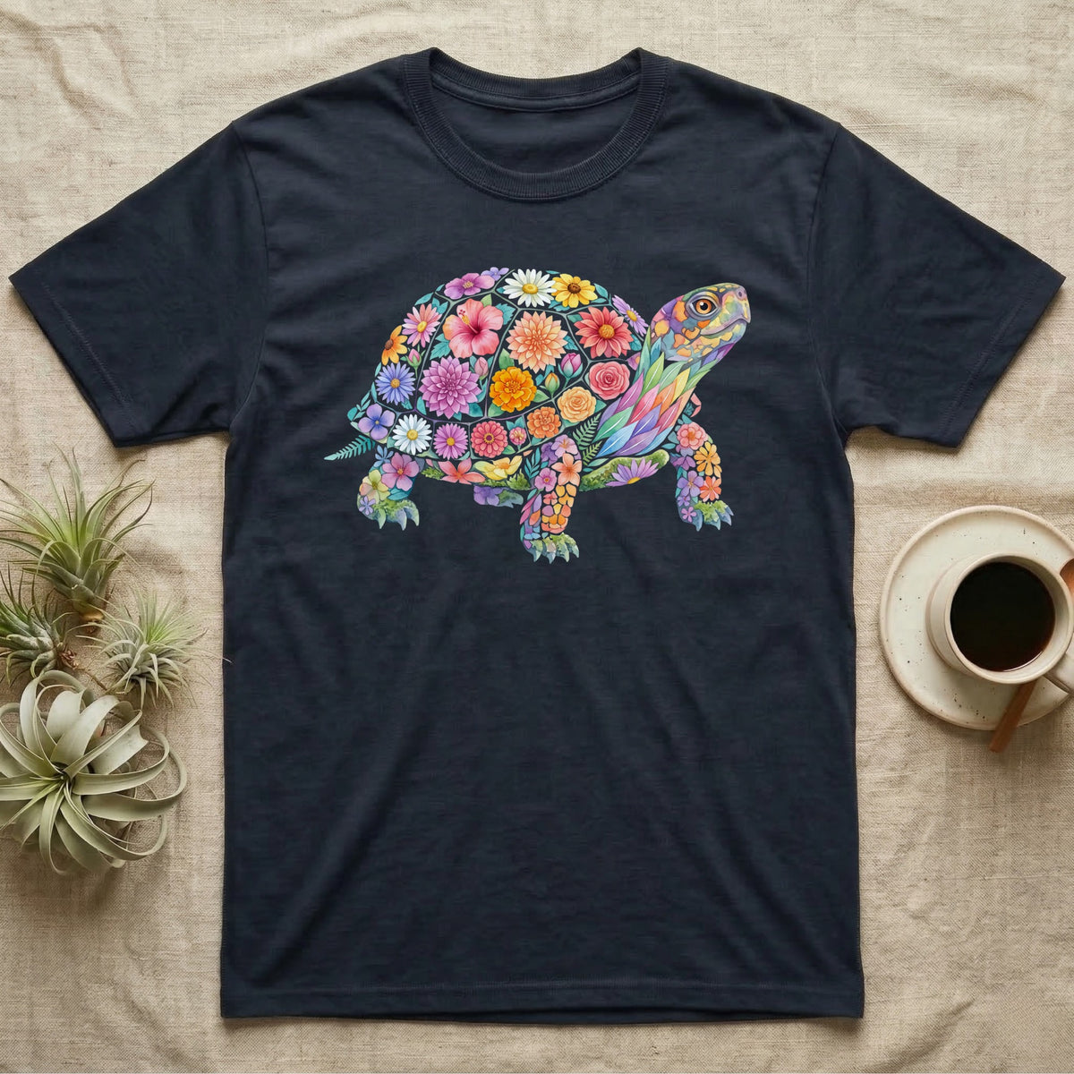 Box Turtle Mosaic T-Shirt in Navy — An eastern box turtle on a rising diagonal, its domed shell and legs built from painted watercolour flowers and leaves.