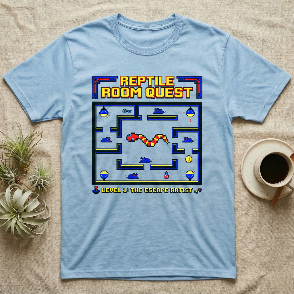 Light blue t-shirt with pixelated "Reptile Room Quest Level 1: The Escape Artist" video game design.