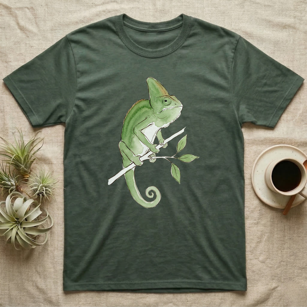 Veiled Chameleon Ambassador T-Shirt in Military Green — Watercolour illustration of a veiled chameleon calmly gripping a slender branch, tall casque and curled tail.