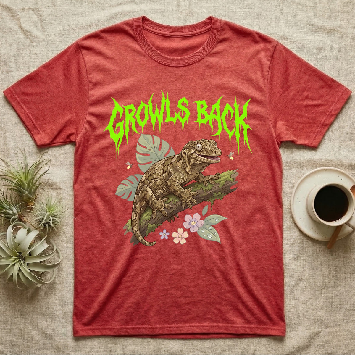 Leachianus Gecko Feral T-Shirt in Heather Red — Leachianus giant gecko on a mossy branch under jagged lime-green metal text GROWLS BACK with pastel leaves