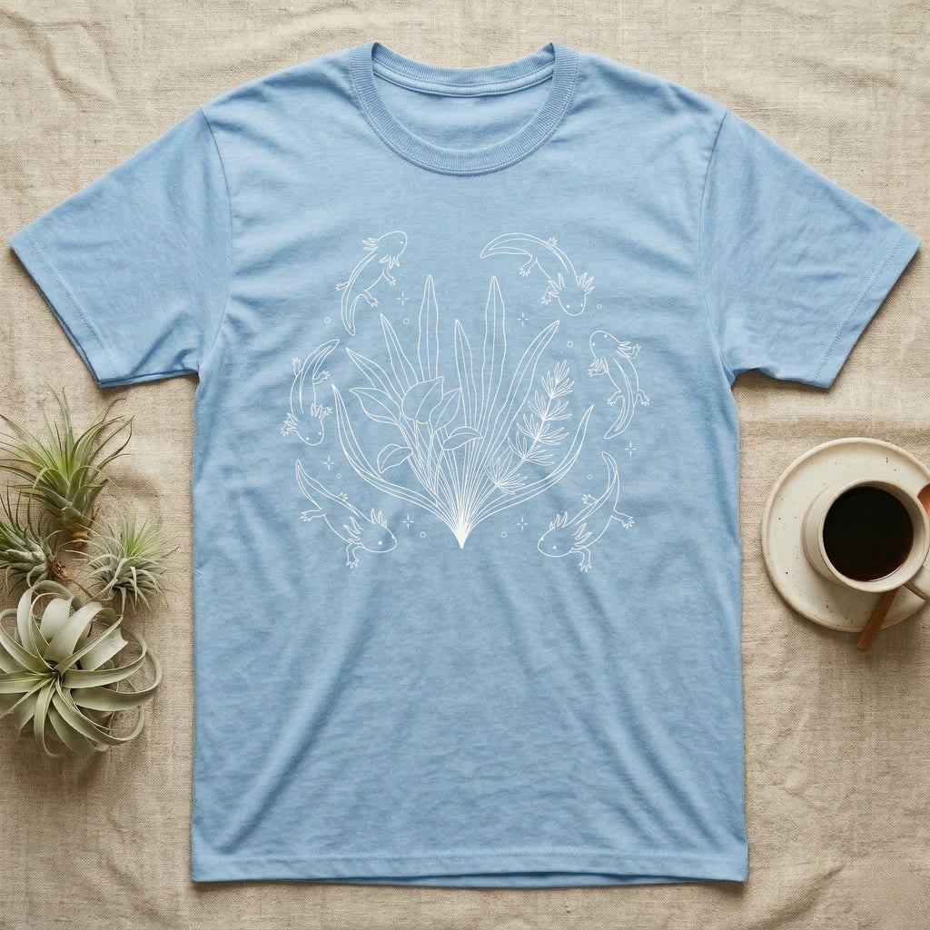 Axolotl Fine Line Botanical T-Shirt in Light Blue — Fine-line white ink illustration of five axolotls drifting around a fanned spray of anubias and java fern.