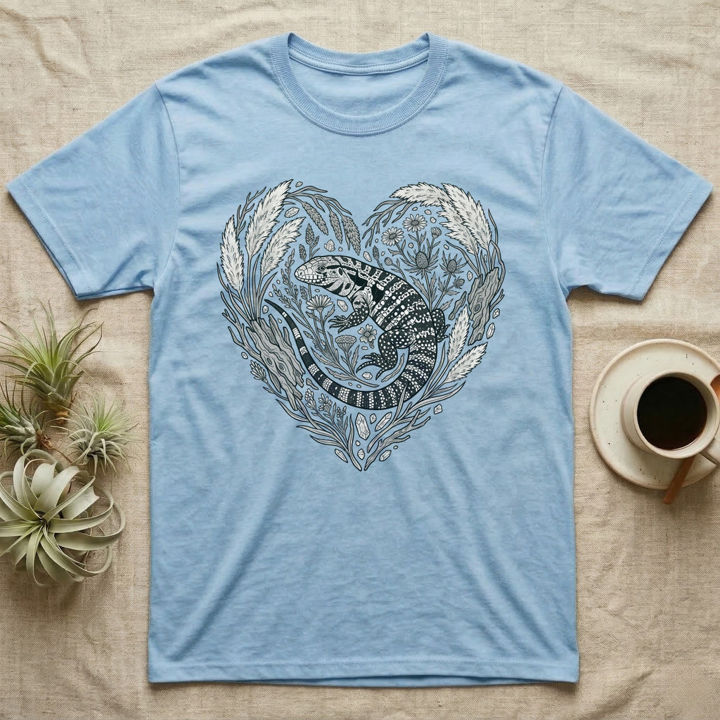 Light blue t-shirt with a heart-shaped floral design featuring a lizard.