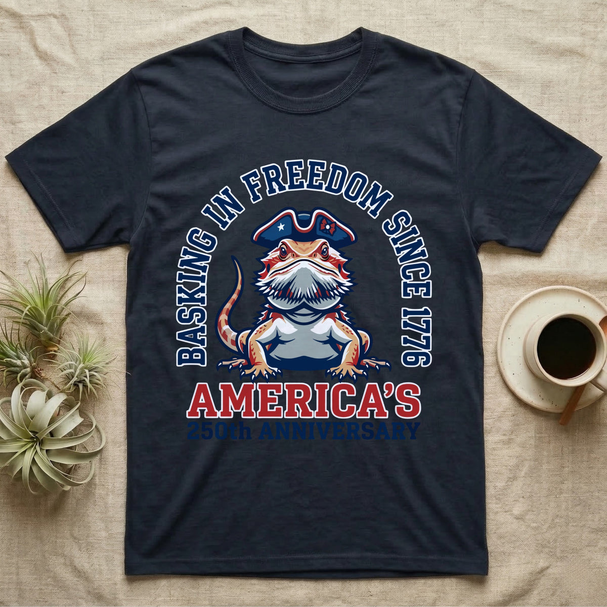 Bearded Dragon Basking T-Shirt in Navy — Sports-logo bearded dragon in a tricorn hat under a collegiate arch reading Basking in Freedom Since 1776.