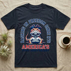 Bearded Dragon Basking T-Shirt in Navy — Sports-logo bearded dragon in a tricorn hat under a collegiate arch reading Basking in Freedom Since 1776.