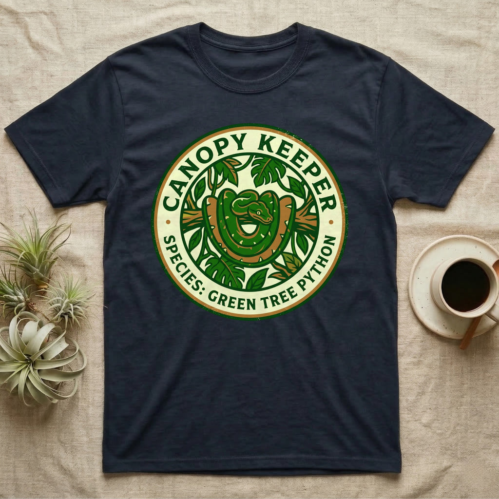Dark t-shirt with round "Canopy Keeper" design featuring a green tree python.