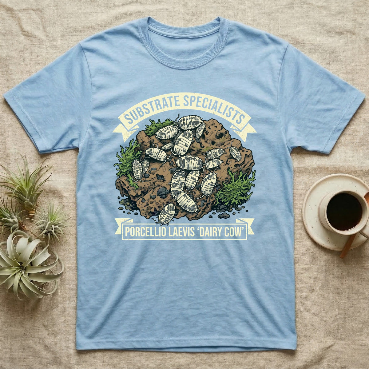 Dairy Cow Isopod Substrate Specialists T-Shirt in Light Blue — Vintage print of a dairy cow isopod colony on a mossy soil clod between "Substrate Specialists" banners.