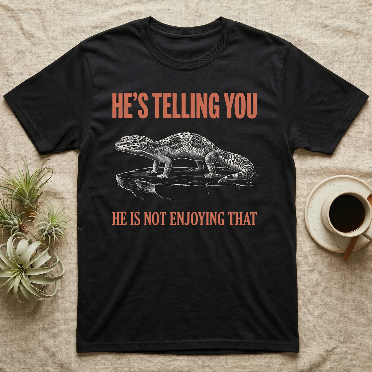 Leopard Gecko Body Language T-Shirt in Black — Engraved leopard gecko in side profile with an arched back and closed eyes, between two lines of type.