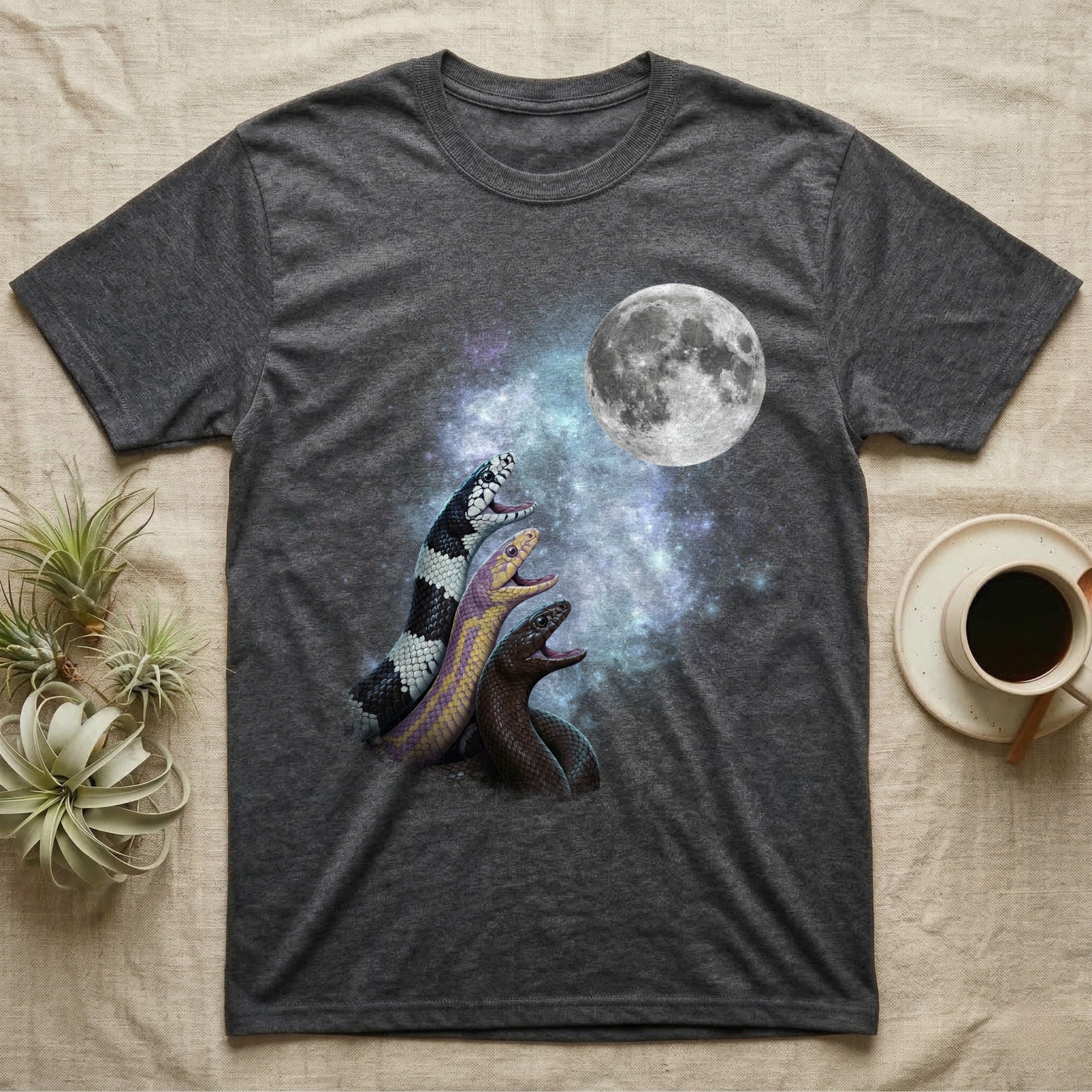 California Kingsnake Moon Howl T-Shirt in Dark Heather — Three California Kingsnake colour morphs howling at a full moon over a nebula on a dark grey t-shirt.