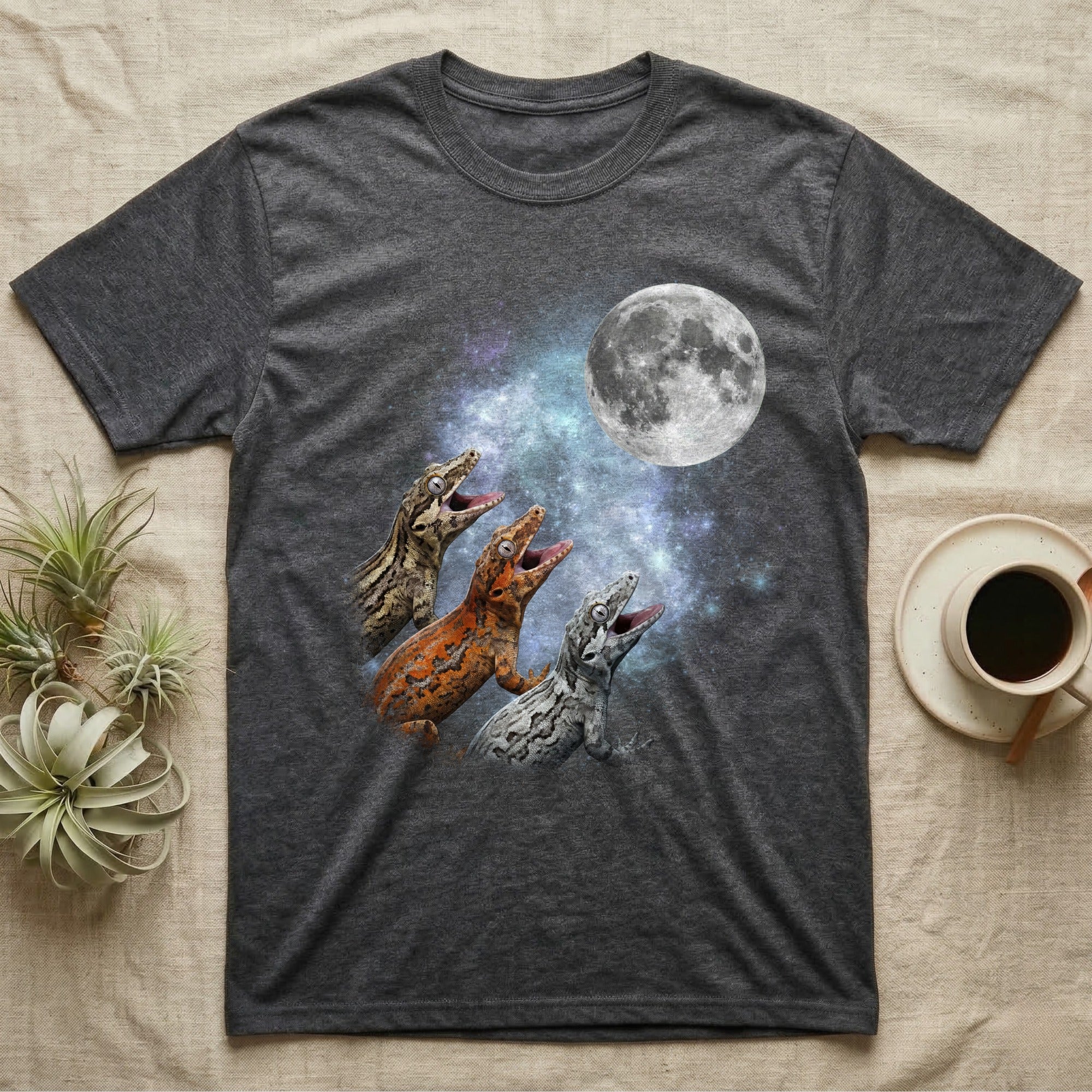 Gargoyle Gecko Moon Howl T-Shirt in Dark Heather — Three Gargoyle Gecko colour morphs howling at a full moon over a nebula on a dark grey t-shirt.