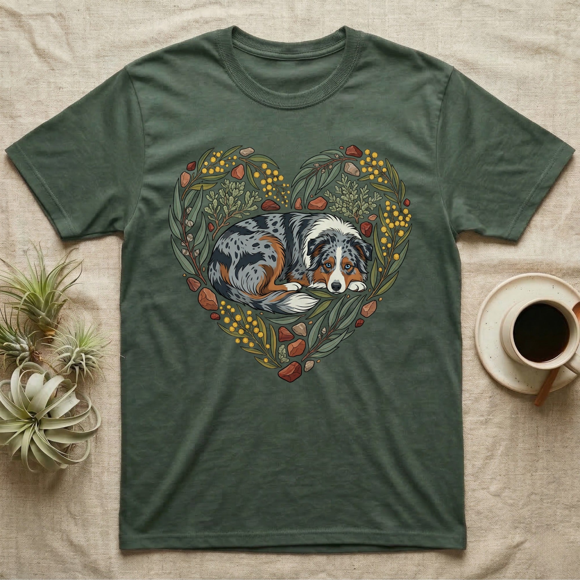 Green t-shirt with Australian Shepherd dog illustration framed by floral heart design.