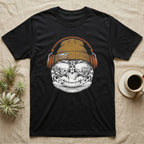 Leopard Gecko Headphones T-Shirt in Black — Engraved leopard gecko with spotted skin in a beanie and headphones, aviators reflecting a desert canyon.