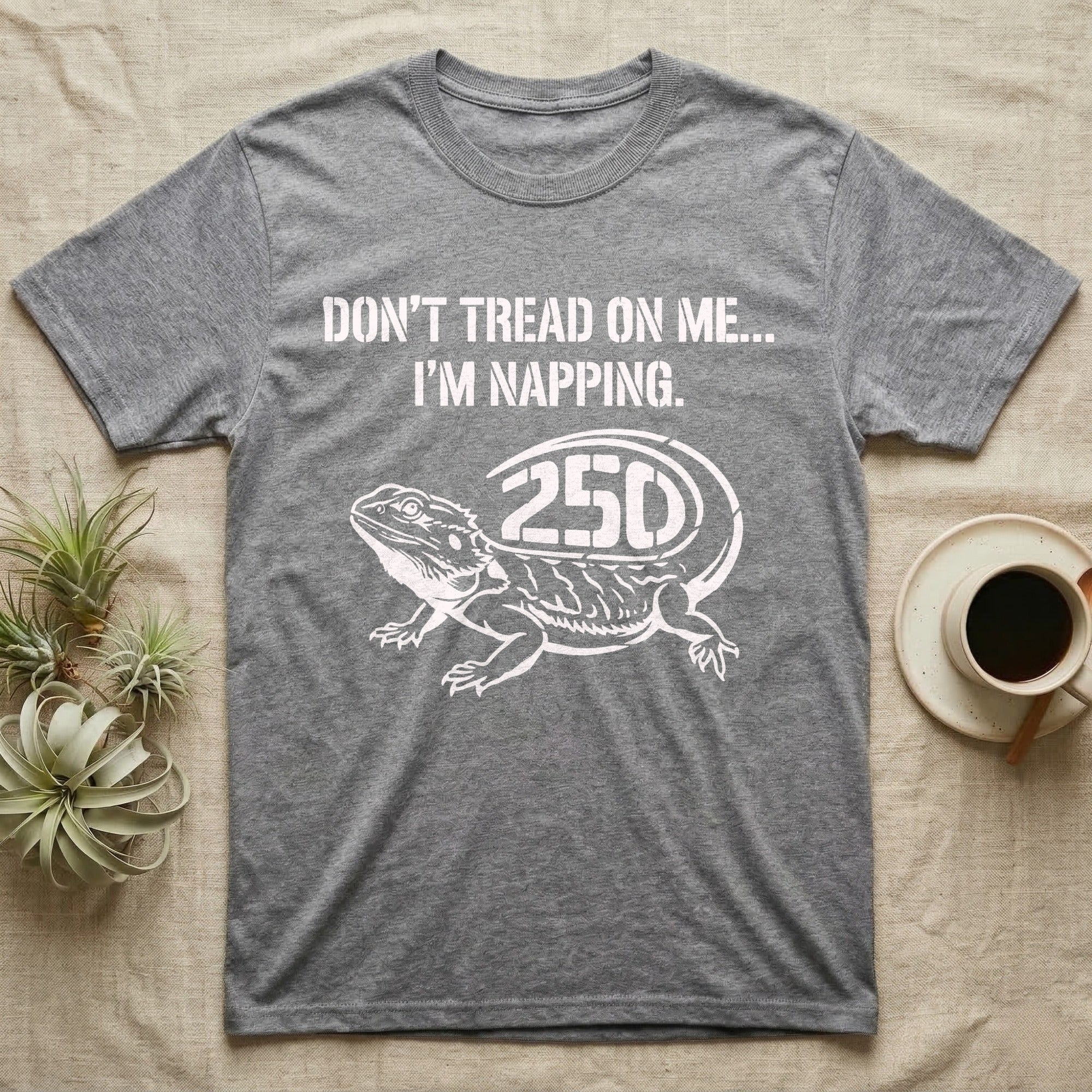 Bearded Dragon Napping T-Shirt in Sport Grey — White stencil bearded dragon resting with 250 cut into the tail under text Don't Tread On Me, I'm Napping.