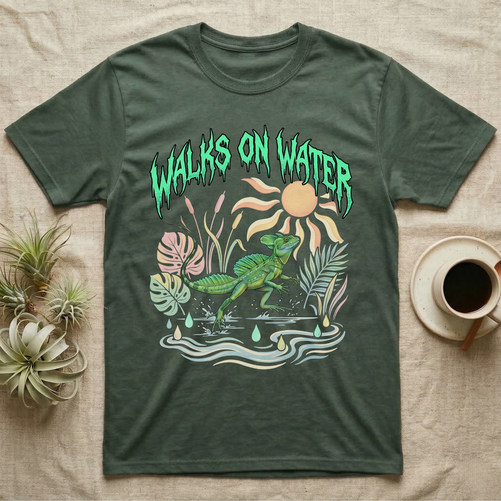Green Basilisk Feral T-Shirt in Military Green — Green plumed basilisk sprinting across water below a dripping aqua-green metal "Walks On Water" wordmark