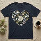 Dark t-shirt with a heart-shaped floral design featuring a sleeping sugar glider.