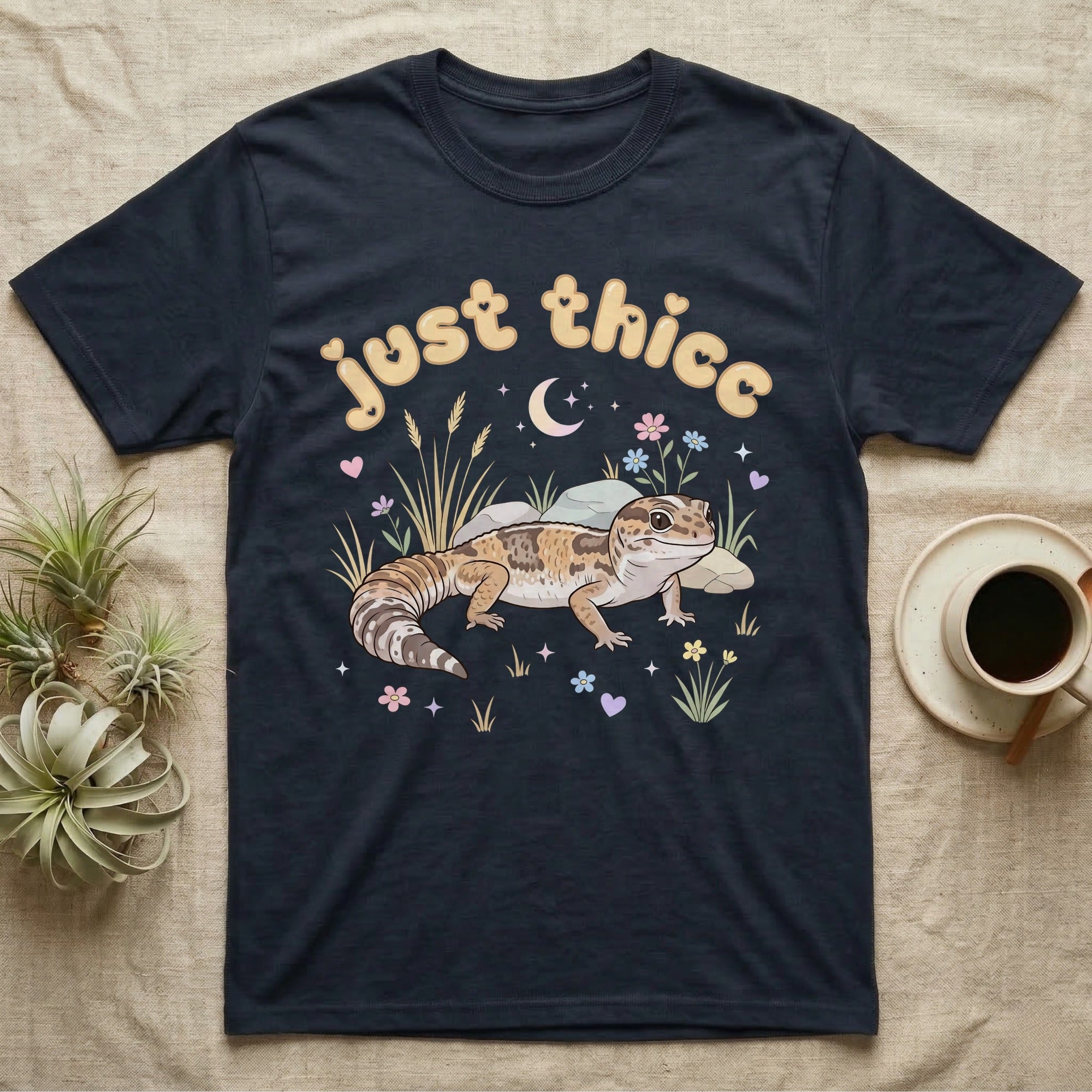 African Fat-Tailed Gecko Softie T-Shirt in Navy — African fat-tailed gecko with a plump tail under a puffy pastel "just thicc" bubble wordmark with tiny hearts.