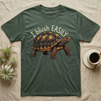 Red-Foot Tortoise Blush T-Shirt in Military Green — Red-footed tortoise with red-orange cheeks and legs walking under the curved words I blush EASILY