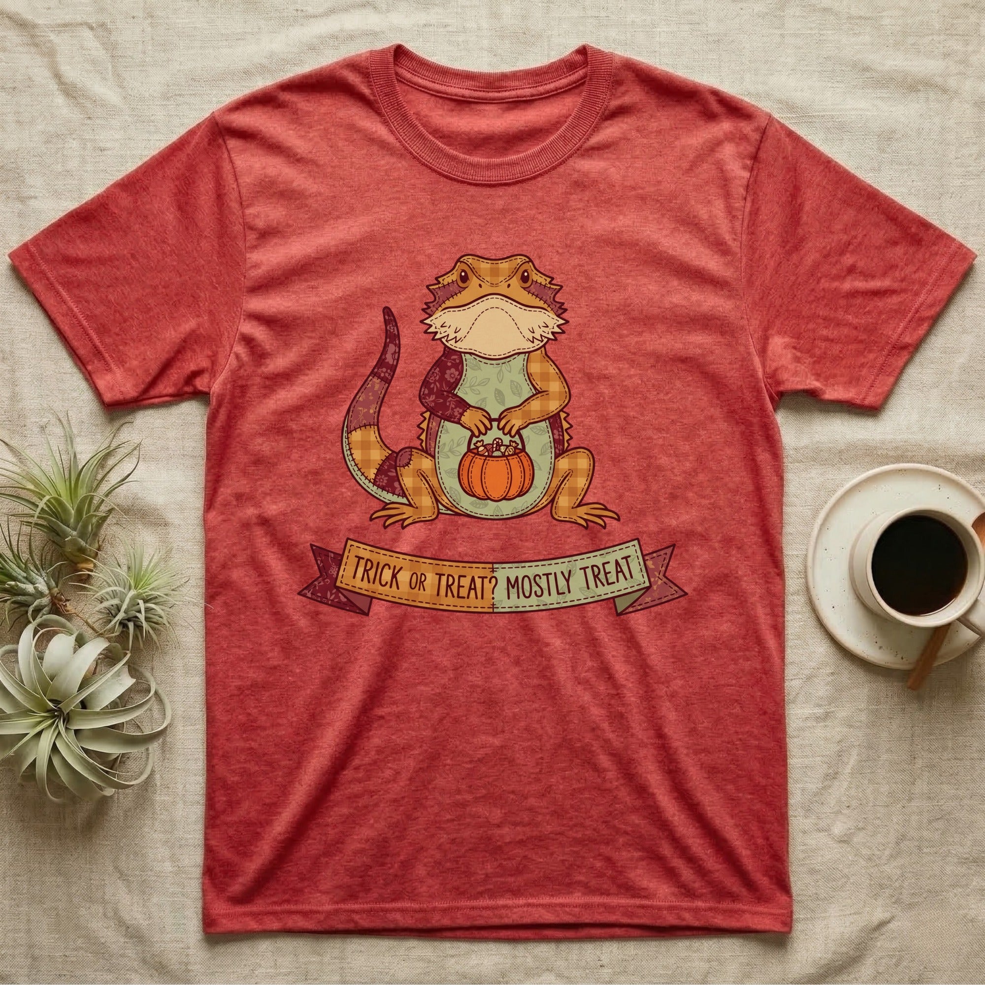 Bearded Dragon Mostly Treat T-Shirt in Heather Red — Patchwork-quilt bearded dragon holding a pumpkin pail, banner reading "Trick or Treat? Mostly Treat."