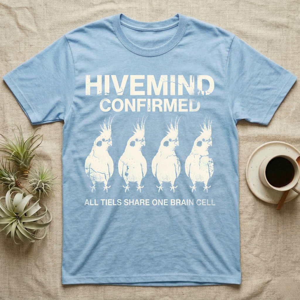Cockatiel Hivemind Confirmed T-Shirt in Light Blue — Grunge-distressed four cockatiels in identical synchronised posture with distressed type "Hivemind Confirmed."