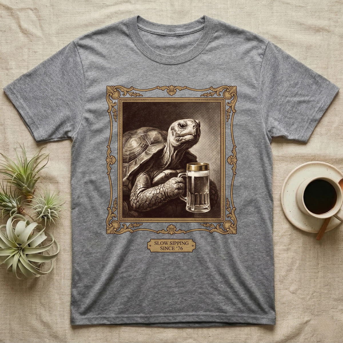 Slow Sipping Tortoise T-Shirt in Sport Grey — Old-master oil portrait of a dignified tortoise holding a beer stein with a brass "Slow Sipping Since '76" plaque.
