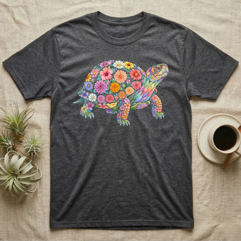 Box Turtle Mosaic T-Shirt in Dark Heather — An eastern box turtle on a rising diagonal, its domed shell and legs built from painted watercolour flowers and leaves.