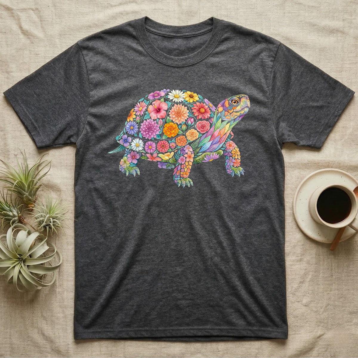 Box Turtle Mosaic T-Shirt in Dark Heather — An eastern box turtle on a rising diagonal, its domed shell and legs built from painted watercolour flowers and leaves.