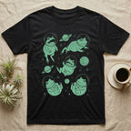 Pacman Frog Cosmic T-Shirt in Black — Vintage screen-print illustration of Pacman frogs in astronaut helmets floating in space, cosmic jade green monochromatic on dark background.