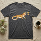 Bearded Dragon Blossom T-Shirt in Dark Heather — Watercolor illustration of an ochre bearded dragon holding a golden wattle blossom sprig, on a dark grey t-shirt.