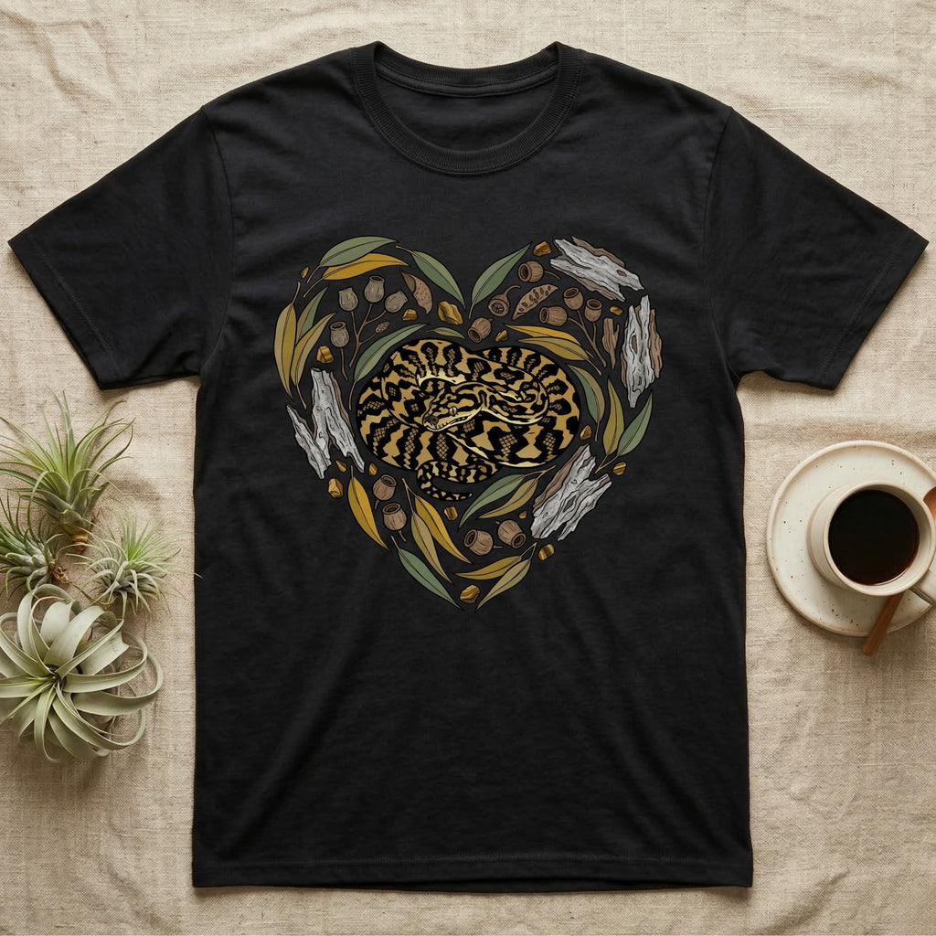 Black t-shirt with a coiled snake in a heart shape surrounded by leaves and acorns.