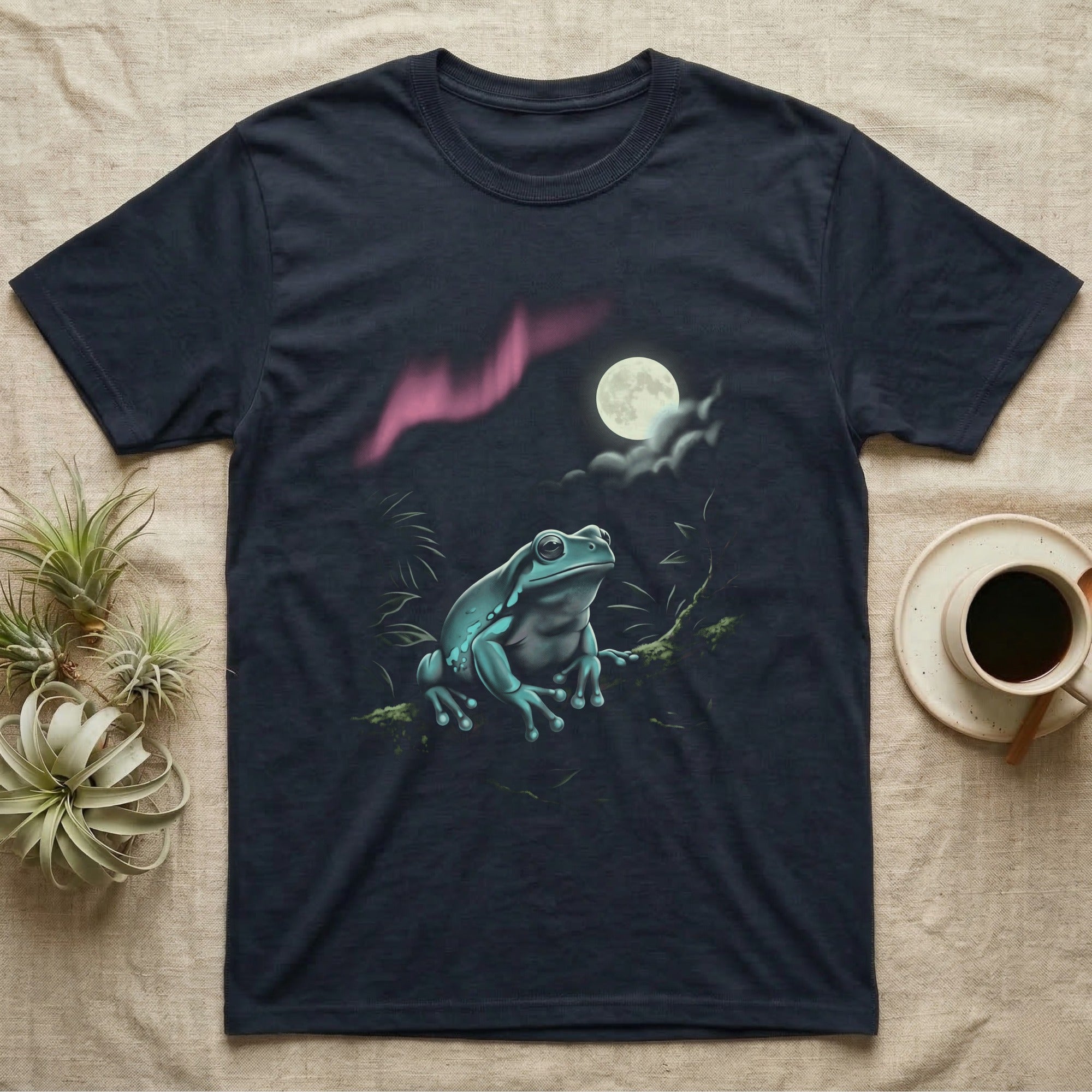White's Tree Frog Moonlit T-Shirt in Navy — Airbrushed White's tree frog rising from moonlit water toward a cream full moon, cyan and pink glow on black.