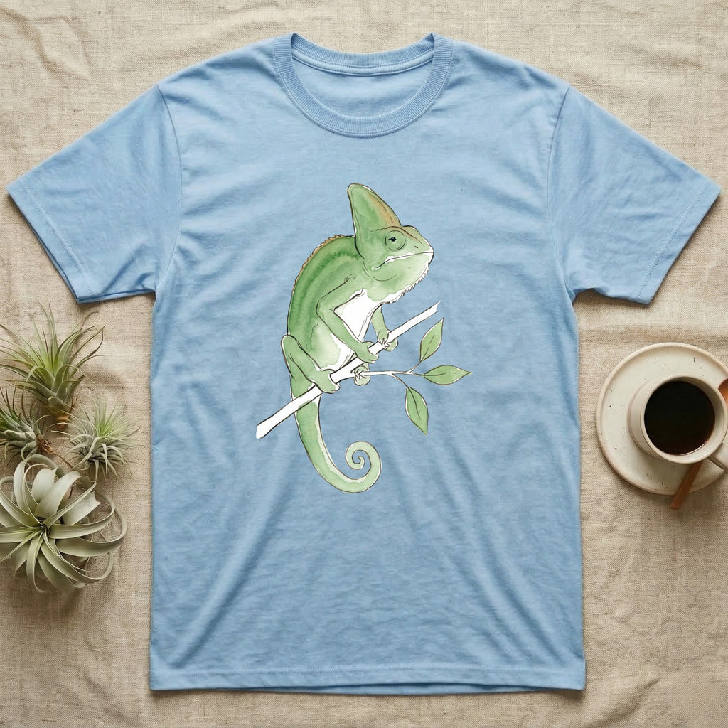 Veiled Chameleon Ambassador T-Shirt in Light Blue — Watercolour illustration of a veiled chameleon calmly gripping a slender branch, tall casque and curled tail.