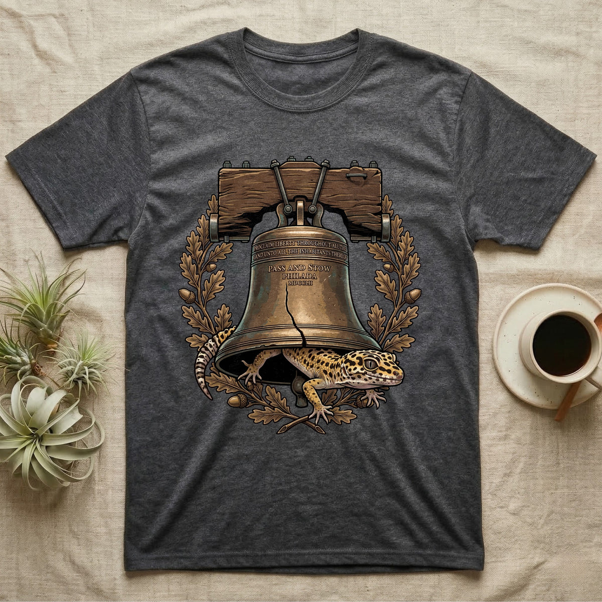 Leopard Gecko Liberty Bell T-Shirt in Dark Heather — Engraved leopard gecko emerging beneath the bronze Liberty Bell inside an oak-leaf and acorn wreath.