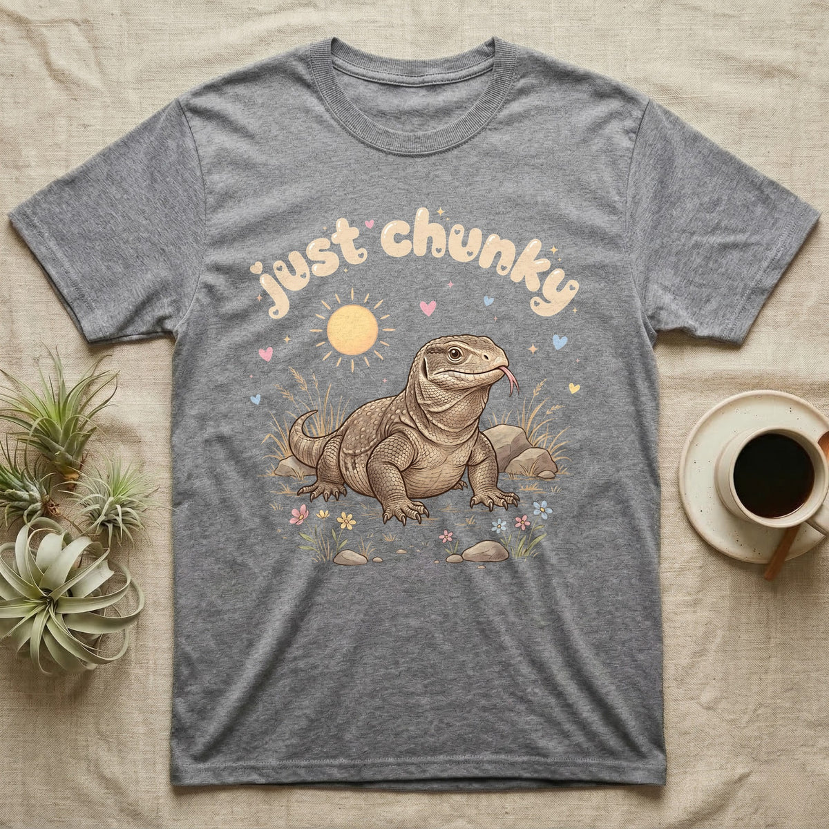 Savannah Monitor Softie T-Shirt in Sport Grey — Plump savannah monitor lizard with flicking tongue under pastel bubble text "just chunky" and hearts.