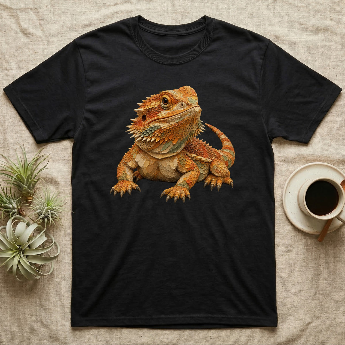 Black t-shirt with a detailed illustration of a bearded dragon.