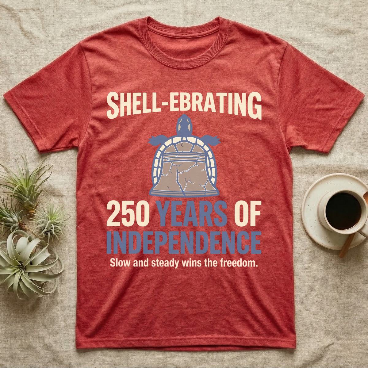 Sea Turtle Liberty Bell T-Shirt in Heather Red — Slate-blue and cream tee of a sea turtle whose shell is drawn as the Liberty Bell under Shell-Ebrating 250 Years text.