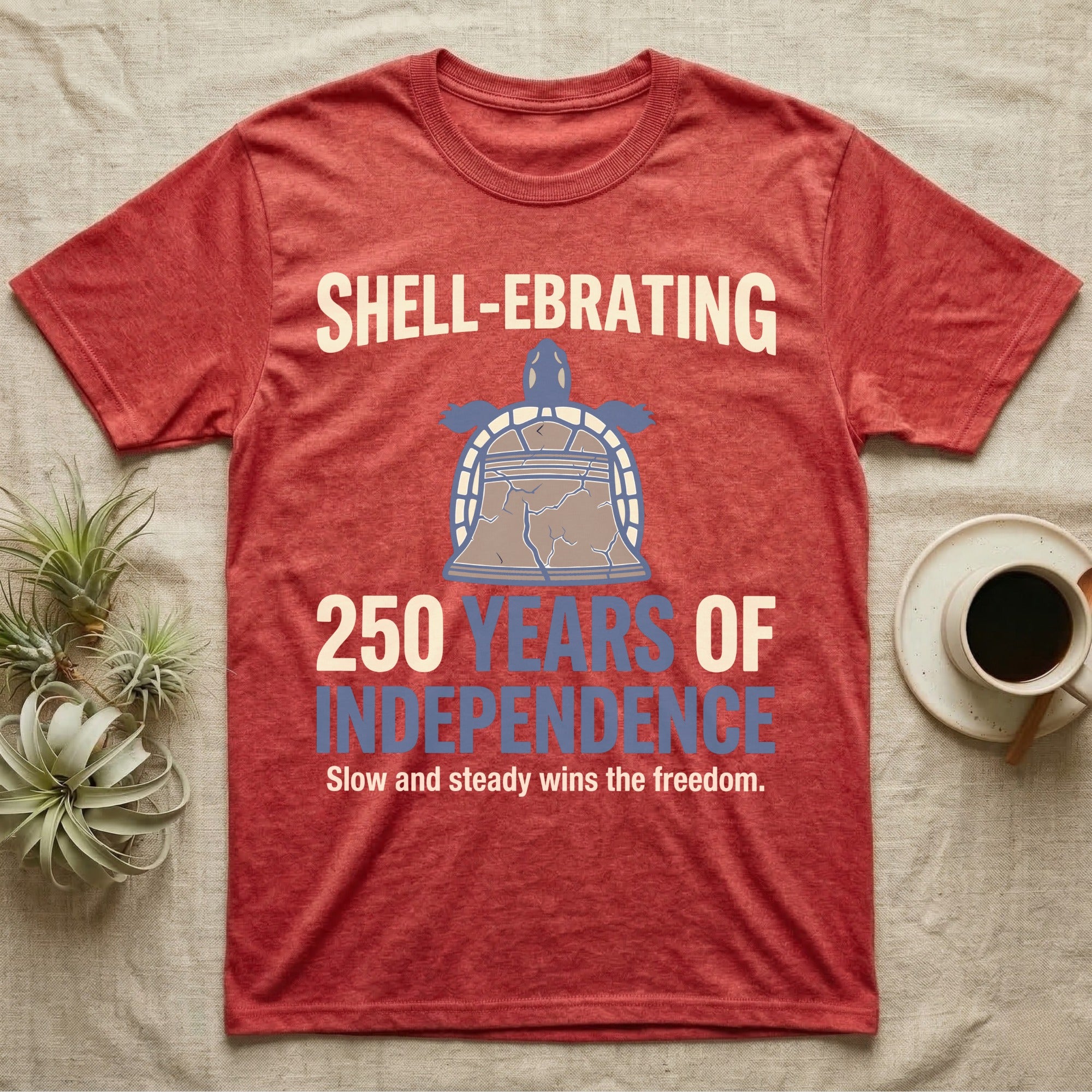 Sea Turtle Liberty Bell T-Shirt in Heather Red — Slate-blue and cream tee of a sea turtle whose shell is drawn as the Liberty Bell under Shell-Ebrating 250 Years text.