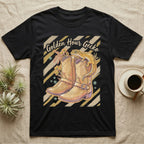 Black t-shirt with golden hour gecko and cowboy boots graphic.