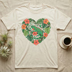 Cream t-shirt with heart-shaped floral design featuring a green iguana.