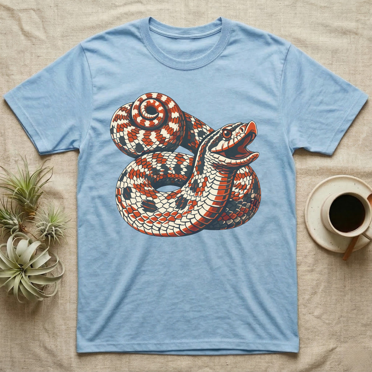 Hognose Snake Hood Flare T-Shirt in Light Blue — Bold three-colour screen-print illustration of a coiled western hognose snake with its neck flared into a hood and mouth open, no on-shirt text.