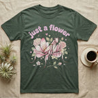 Orchid Mantis Softie T-Shirt in Military Green — Pink orchid mantis mimicking a flower under pastel bubble text "just a flower" with tiny hearts.