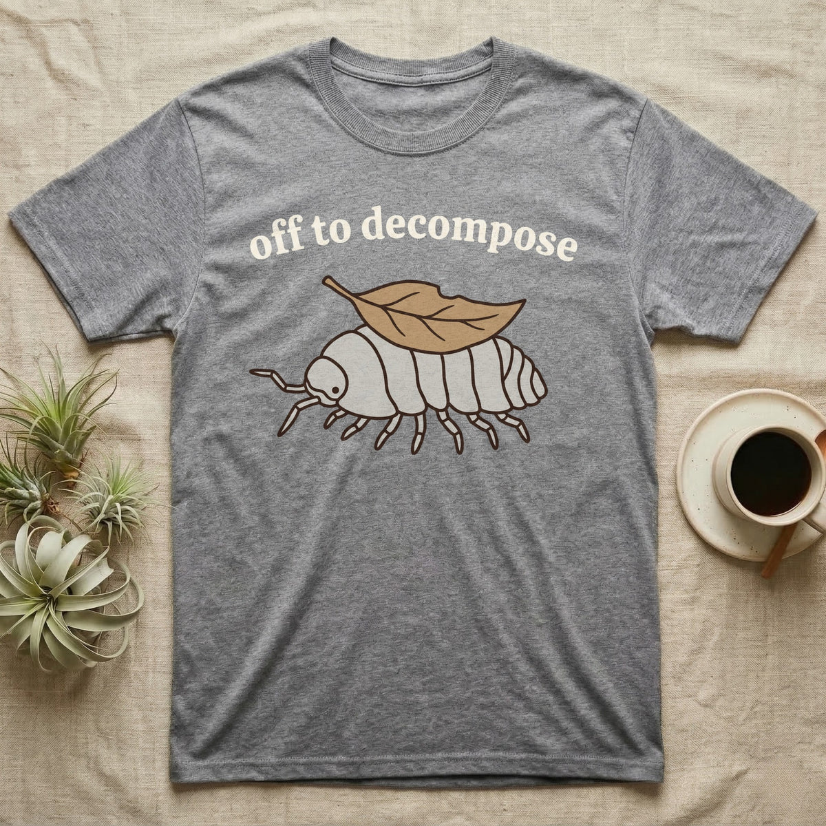 Isopod Decomposer T-Shirt in Sport Grey — Minimal doodle of a grey isopod walking off with a dead leaf on its back under the words off to decompose