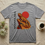 Grey t-shirt with orange lizard and red sun graphic, "SUN SEEKER" text.
