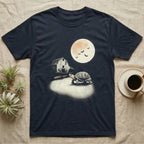 Box Turtle Moonlight T-Shirt in Navy — An eastern box turtle mid-step across a moonlit yard, a derelict barn behind it and a large cream moon high right.