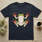 Tree Frog On Glass T-Shirt in Navy — Vector-bold tree frog plastered against implied glass, suction feet splayed wide, small "Tree Frog On Glass." caption.